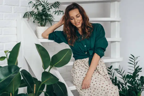 Portrait of young smiling woman at home.