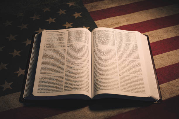 holy bible on a vintage american flag - bible american flag flag old fashioned imagens e fotografias de stock