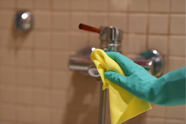 istock cleaning the faucet against coronavirus 1212600780