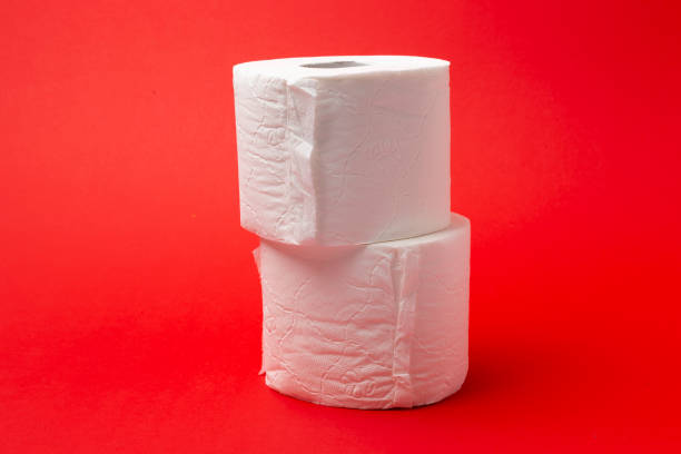 istock Toilet Paper isolated on red background 1212600871
