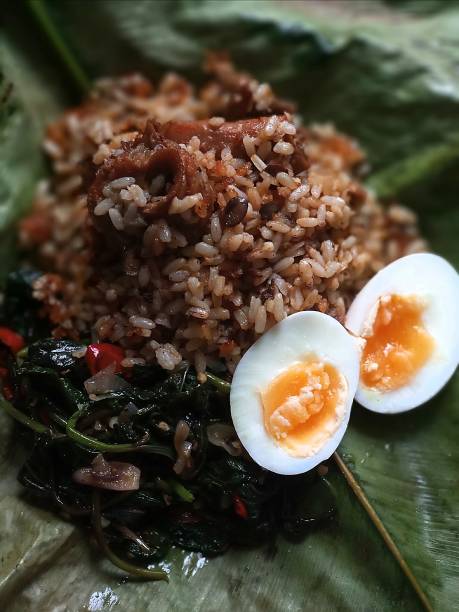 istock Nigerian sweet potato leaf saute and Ofada rice 1212601253