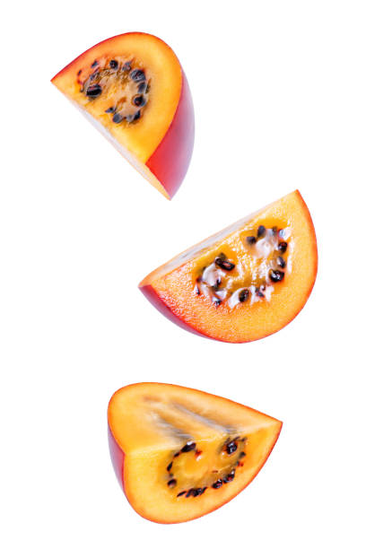 istock Ripe Tamarillo fruit with slices on a white isolated background 1212602674