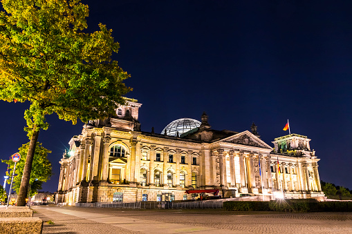 Exterior view German parliament building at night. Also known as Deutscher Bundestag or Reichstag. Berlin, Germany