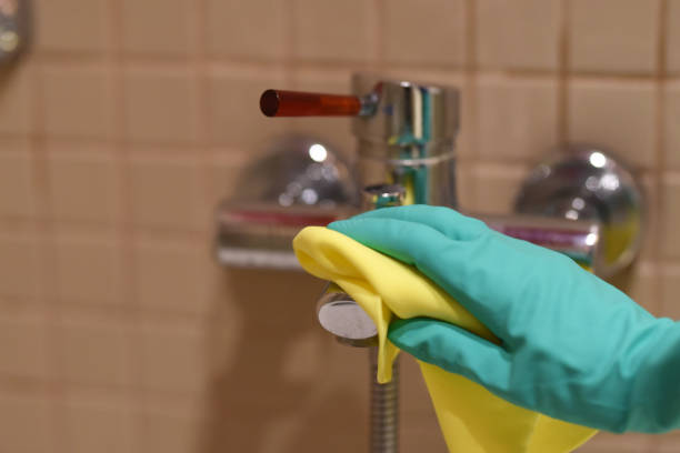 istock cleaning the faucet against coronavirus 1212603927