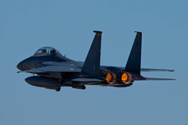 istock F-15 Eagle in a very close rear view, with afterburners on, in beautiful light 1212605001