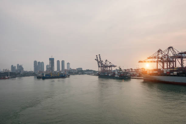 istock Cargo ship anchored in cargo container in warehouse port. 1212606407