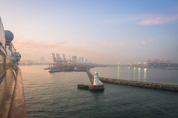 Cruise ship entering Colombo port at sunrise.