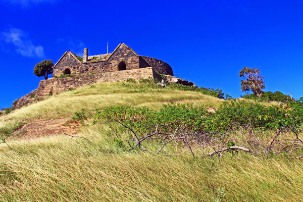 Blue sky copyspace of Old Fort Barrington on the hilltop of Five Islands Peninsula between Deep Bay and St. John’s Harbour, Antigua Barbuda Lesser Antilles, West Indies, Caribbean formally known as Goat Hill.