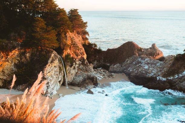 mcway falls in big sur - water waterfall sky seascape stock-fotos und bilder