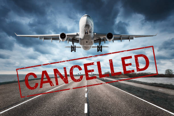 Canceled flights in Europe and USA airports. Travel vacations cancelled because of pandemic of coronavirus. Flying passenger airplane and runway. Flight cancellation. Aircraft with text. Covid-19 Canceled flights in Europe and USA airports. Travel vacations cancelled because of pandemic of coronavirus. Flying passenger airplane and runway. Flight cancellation. Aircraft with text. Covid-19 delayed sign photos stock pictures, royalty-free photos & images