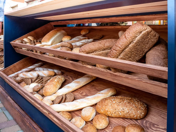 Different kinds of bread on the counter in the bakery shop