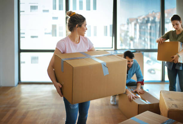istock Friends moving in together. 1212614666
