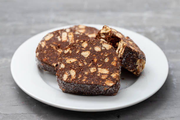istock delicious dessert chocolate biscuit salami on white plate 1212617650