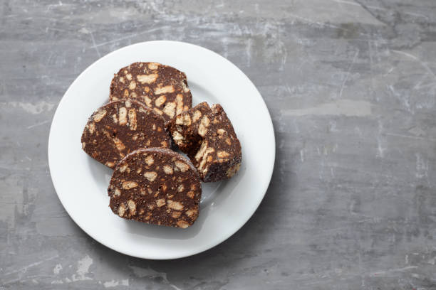 delicious dessert chocolate biscuit salami on white plate