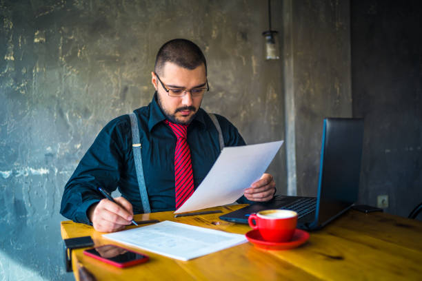 istock Businessman at cafe preparing himself for a meeting 1212621131