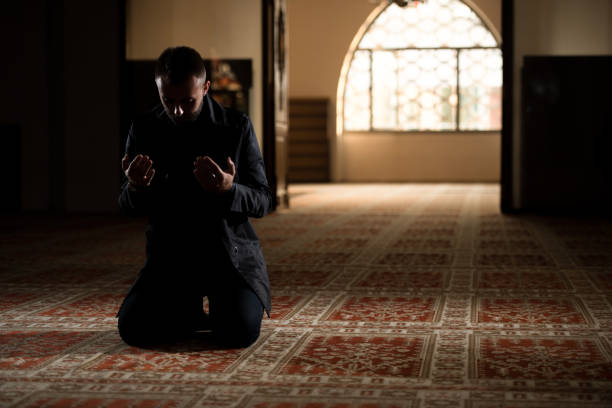 istock Muslim Man Is Praying In The Mosque 1212621935