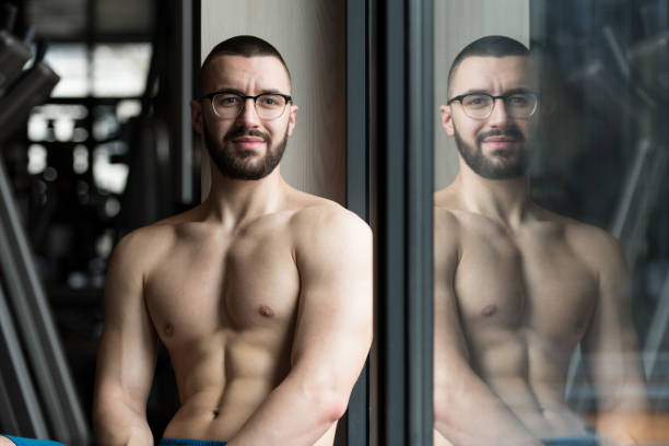 istock Muscular Man After Exercise Resting In Gym 1212622159