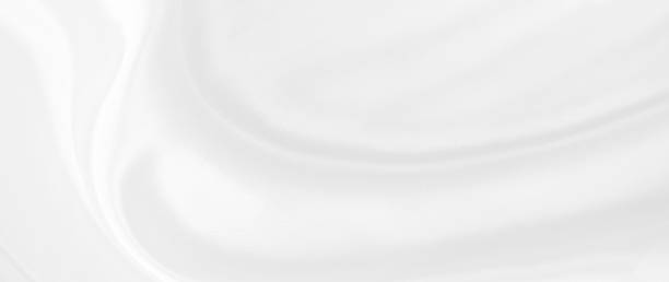 istock White gray satin texture that is white silver fabric silk panoramic background with beautiful soft blur pattern natural. 1212623005