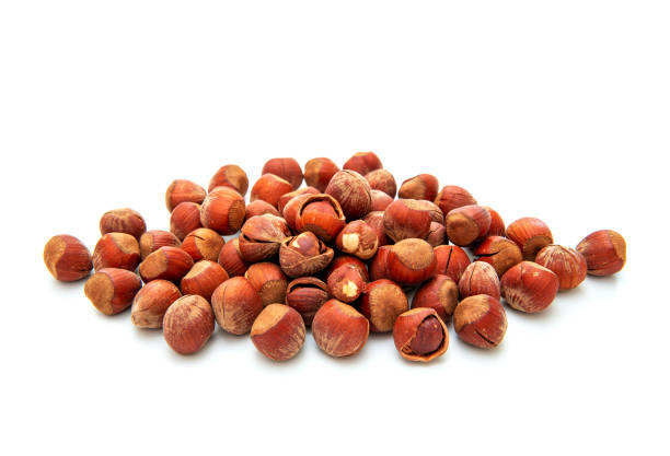 Pile of hazelnuts isolated on white background