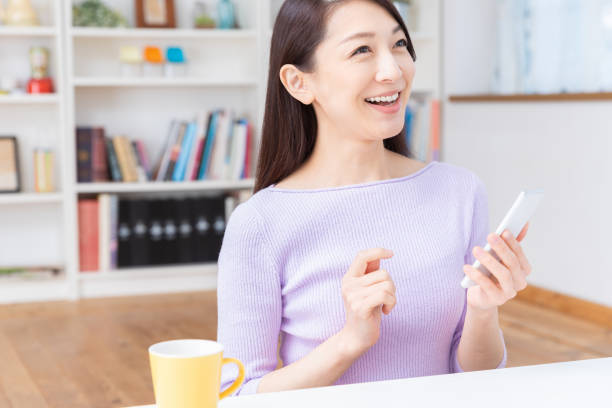 istock asian woman to see a smart phone 1212633232