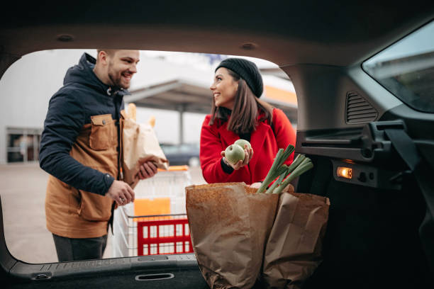 istock Young couple in groceries shopping 1212633983