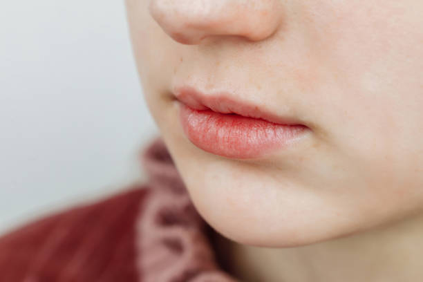 istock Lips after permanent makeup in beauty salon 1212634346