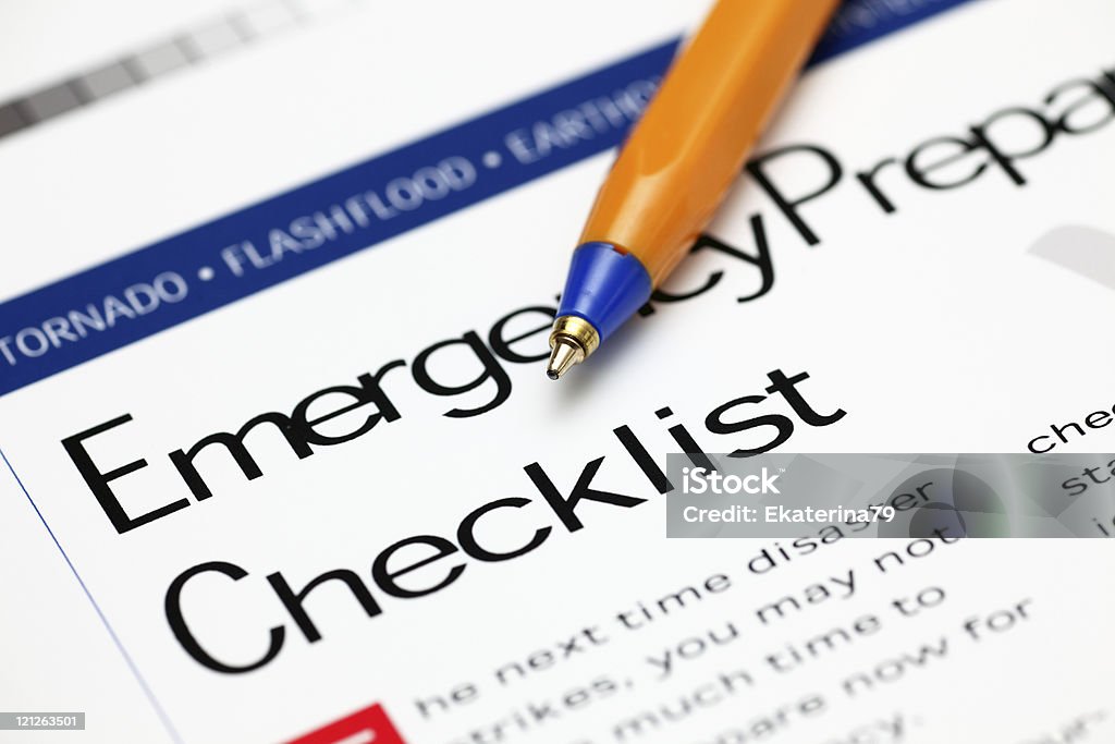 Emergency Checklist and ballpoint pen  Natural Disaster Stock Photo