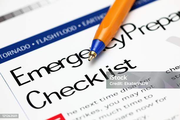 Emergency Checklist And Ballpoint Pen Stock Photo - Download Image Now - Natural Disaster, Advice, Arranging