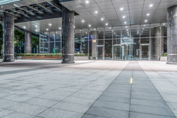 istock night view of empty brick floor front of modern building 1212635103