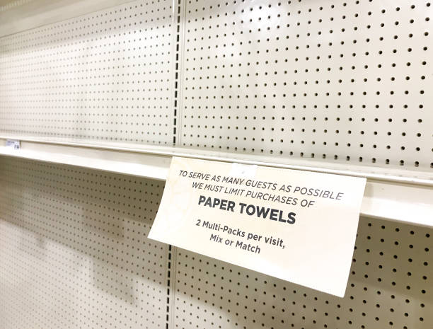istock Empty Shelves: Shop Sign Announcing Limit on Paper Towels 1212635216