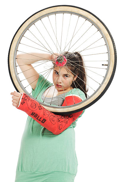 istock Girl with tire and plaster cast 121264352