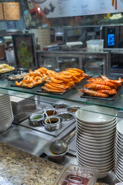 istock Cooked shrimps for cooking ingredients at kitchen counter in restaurant 1212644082