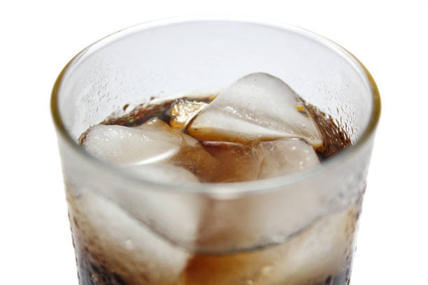 istock Close up view of cold cola with ice cubes 1212647453
