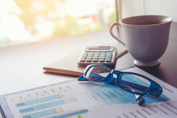 Excel graph with Spreadsheet Document showing Information Financial Startup Concept. Financial Planning making Accounting Database Report. Graphs and chart on screen with stationery set business stuff
