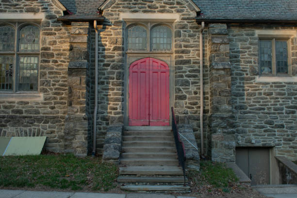 istock A Red Door on an Old Cobblestone Church 1212648061