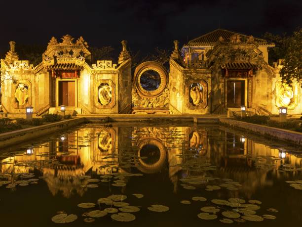 istock Ancient Pagoda Wall in Hoi An, Vietnam by Night 1212648334