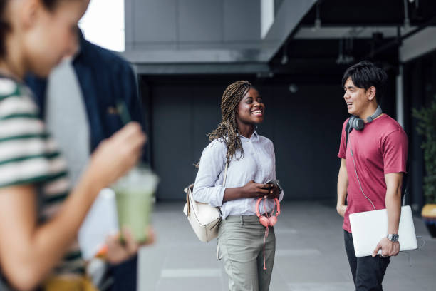 istock Students Chatting in front of a College 1212648486