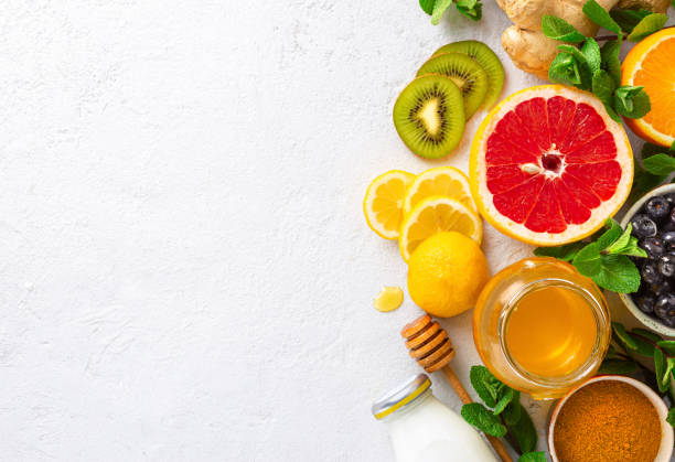 istock Healthy products for Immunity boosting on white background with copy space top view. Vegetables and fruits to boost immune system 1212650257