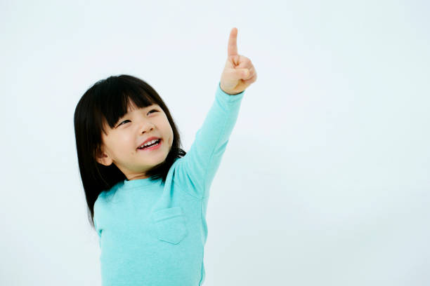 istock Korean girl pointing 1212651172