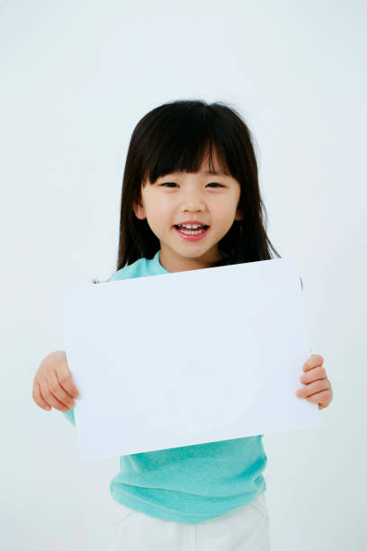 istock Korean girl holding white board 1212651230