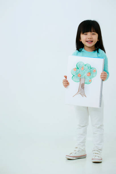 istock Korean girl with drawing 1212651374