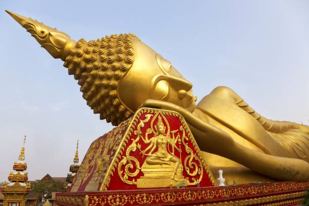 istock Reclining Gold Covered Buddha, Pha That Luang, Vientiane Laos 1212651431