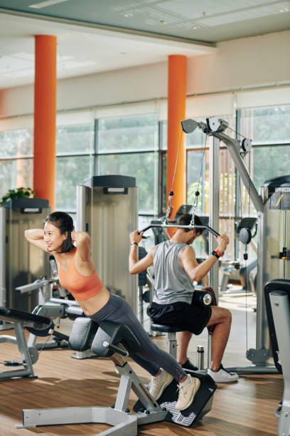 istock Young people exercising in gym 1212654120