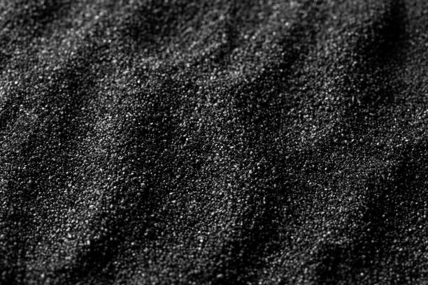 Black sand dunes background. Bump trace. Creative sand relief. Black sand dunes background. Bump trace. Creative sand relief black sand stock pictures, royalty-free photos & images