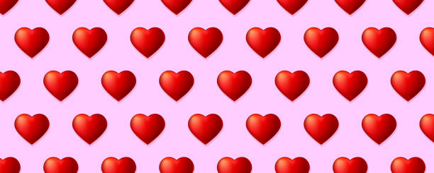 istock Seamless pattern with volume red hearts isolated on pink long background. Shapes of hearts in chequerwise for Valentine s day, template for fabric, wrapper, banners. 1212655078