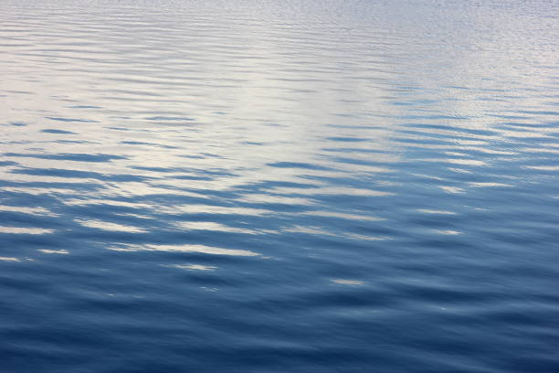 istock view of calm blue water in a spring river with reflected clouds 1212655602