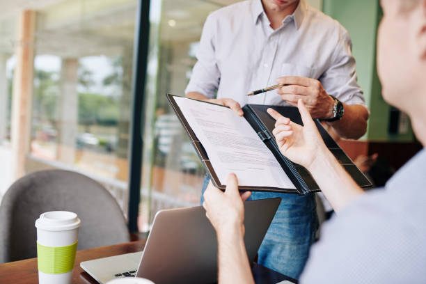 istock Business people signing agreement 1212656856