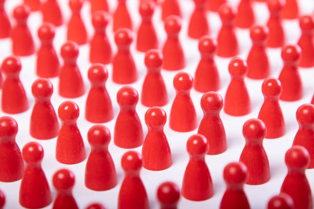 istock red wooden figurines with space in between and arranged in an orderly manner 1212659120