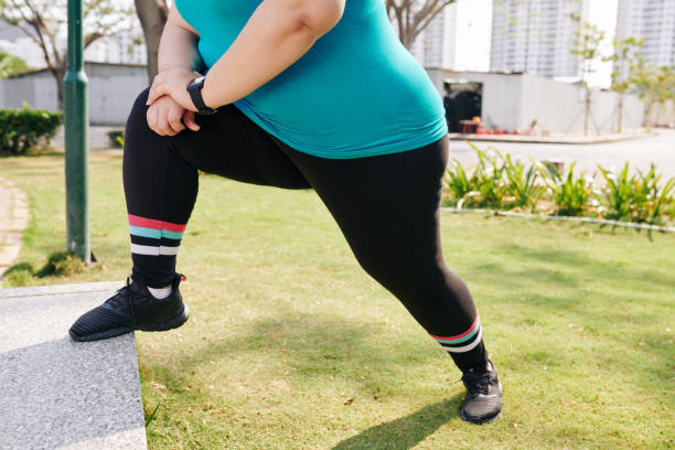 istock Stretching overweight sportswoman 1212659949