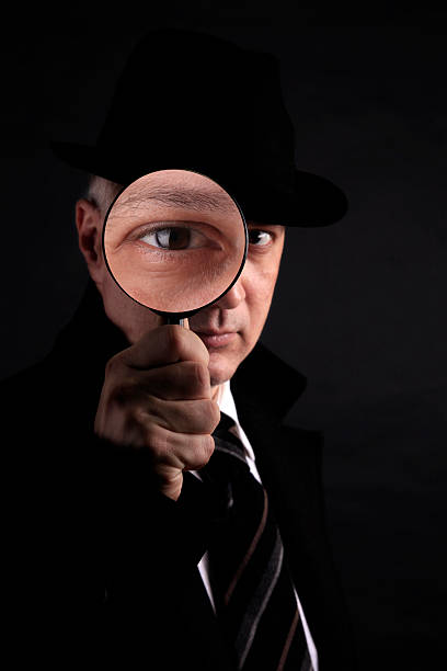 istock Detective investigate with magnifying glass 121266655